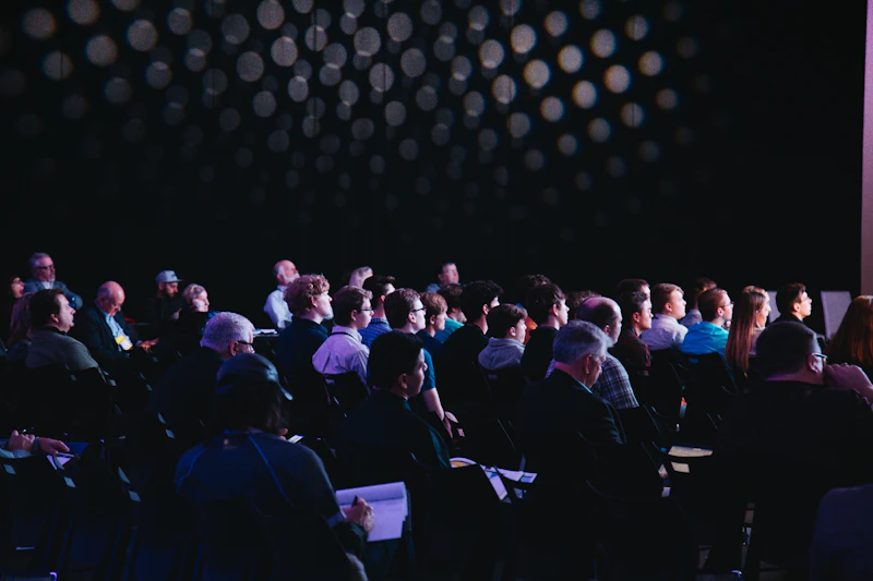Conference attendees networking at a ticketed business event